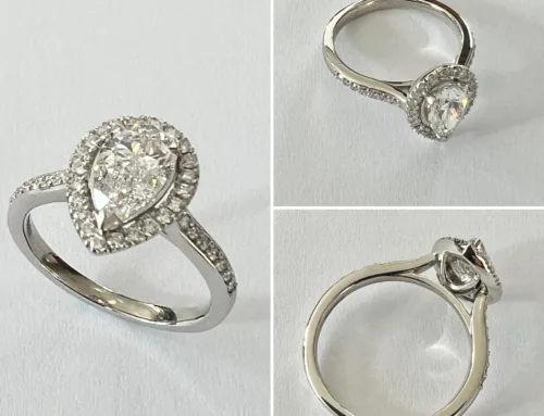Drop shaped diamond with halo, engagement ring